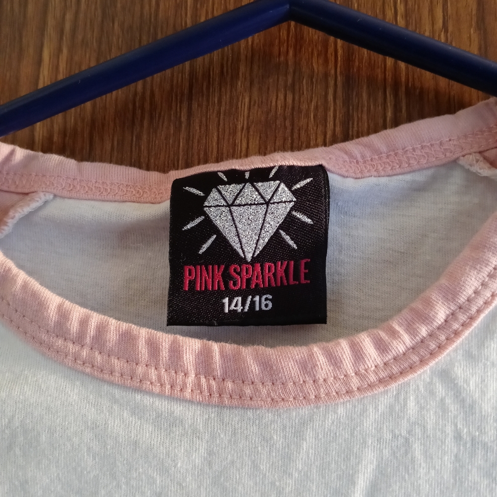 A pink and white little girl shirt